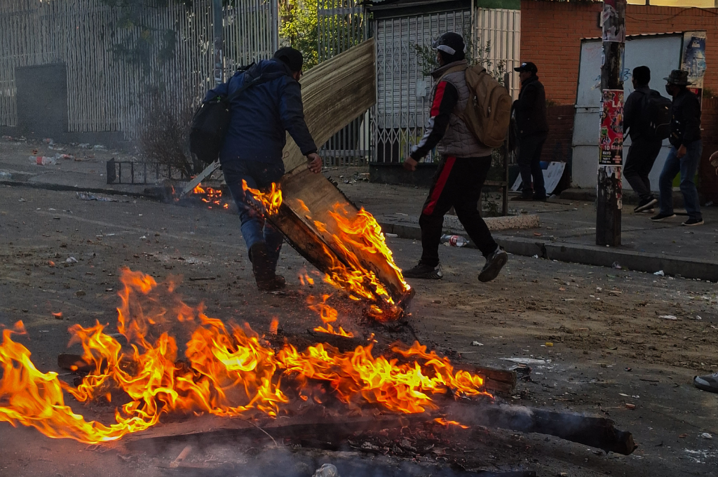Bolivian government charges labor leader with terrorism as police crack down on protests