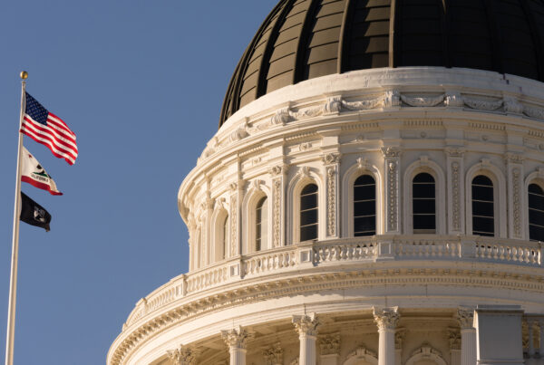 California capitol dome with flags flying