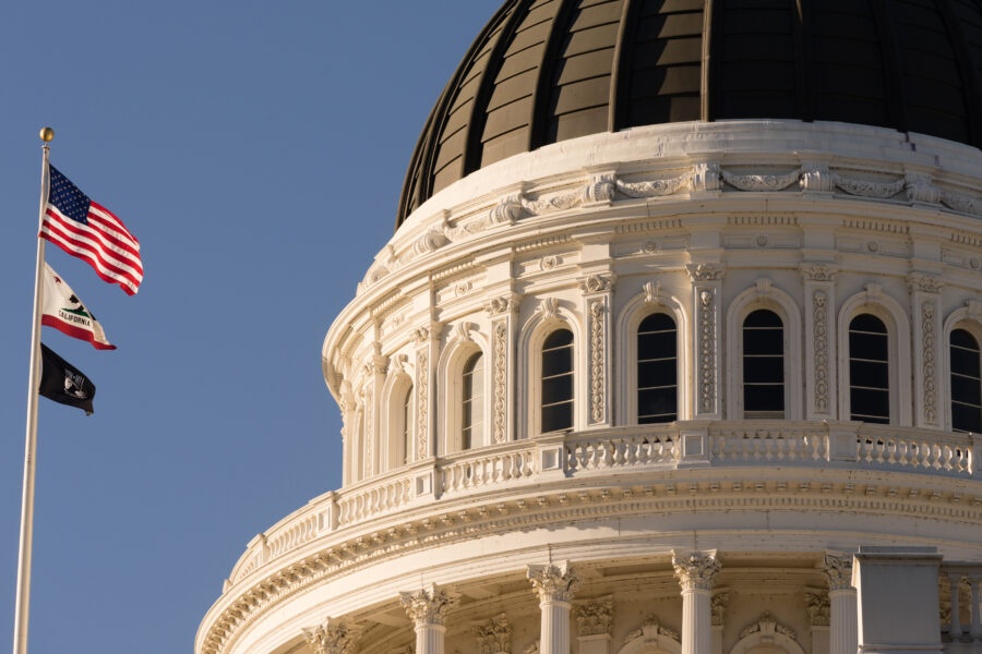 California capitol dome with flags flying