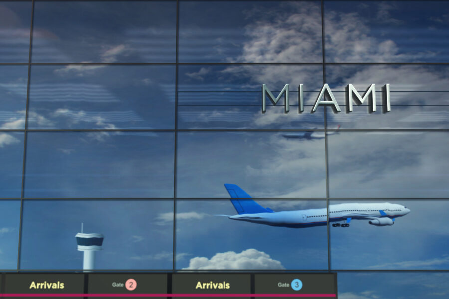 Plane reflecting off a glass wall at Miami International Airport