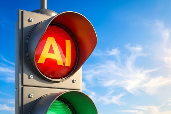 traffic light where the red is illuminated and says 'AI' in it