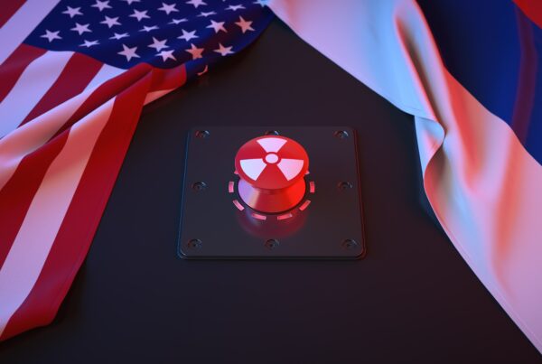 American and Russian flags, nuclear button in the middle