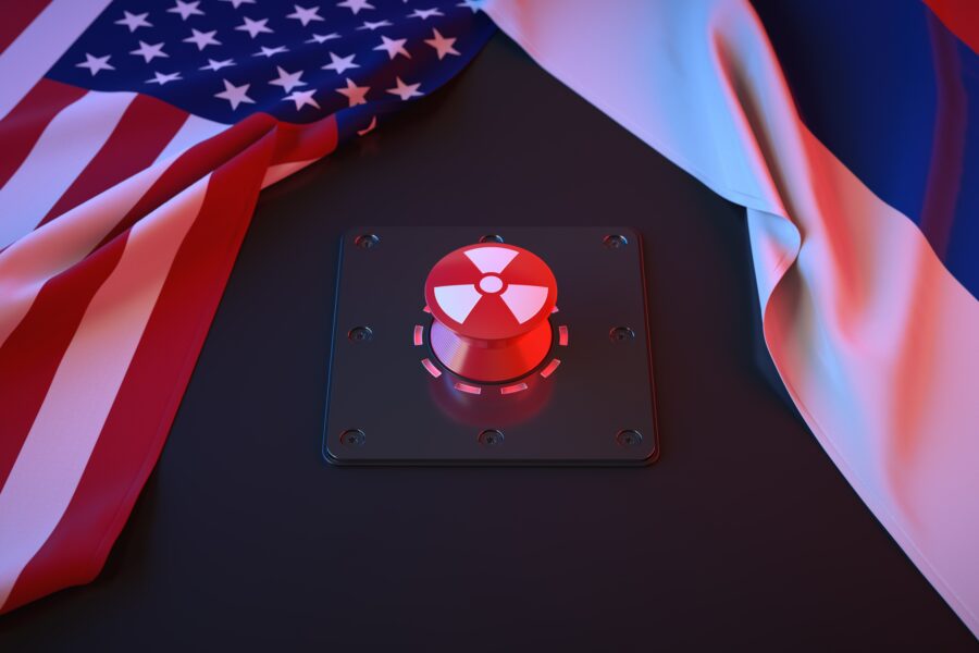 American and Russian flags, nuclear button in the middle